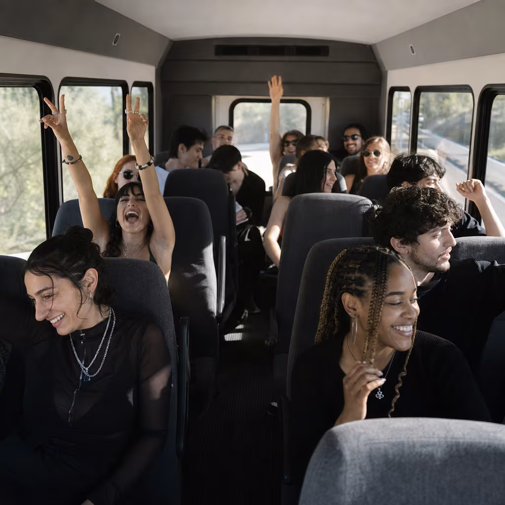 Party bus interior with wraparound leather seating and LED lighting in Boynton Beach